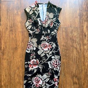 Black dress with floral design and neck detail
